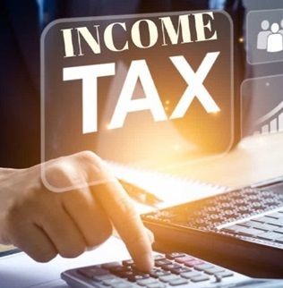 Person using calculator with 'Income Tax' text overlay on a glowing background.